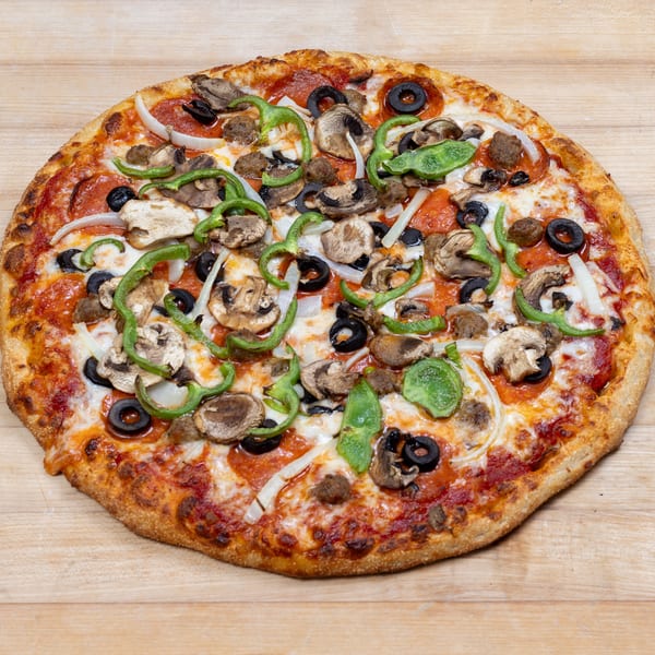 A whole pizza with pepperoni, sausage, mushrooms, green peppers, onions, and black olives.